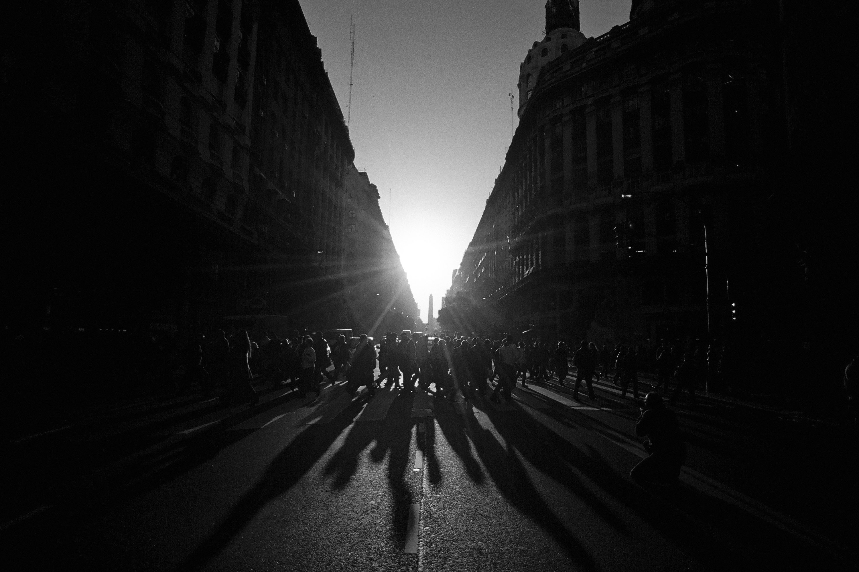 Pedestrians crossing a sunlit avenue, Buenos Aires